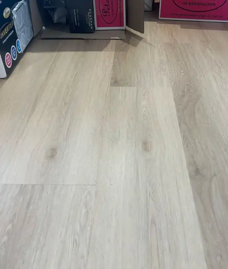 Laminate floor after repair, with no visible chips or damage.