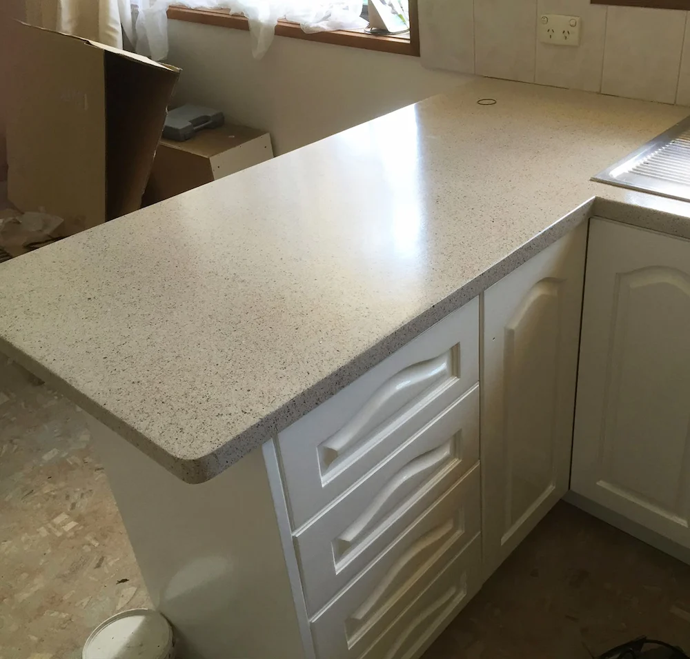 Kitchen benchtop after professional resurfacing with a smooth, polished finish