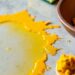 Countertop with turmeric stain and cleaning supplies.