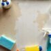 Stone benchtop with cleaning tools for stain removal.