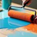 Person painting a laminate benchtop with a roller.