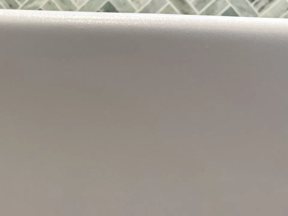 The same side of the bath after the chip was filled, matched to the white and sealed