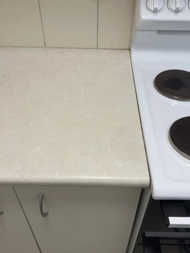 The same benchtop after the three burns were filled and the stone pattern matched