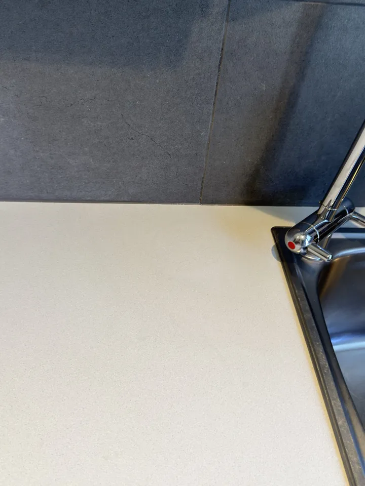 The same benchtop after the round burn was filled and colour matched