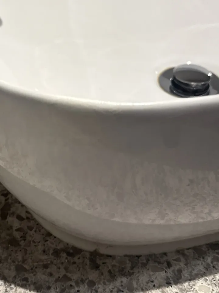The same basin after the chip was filled, matched to the white and sealed